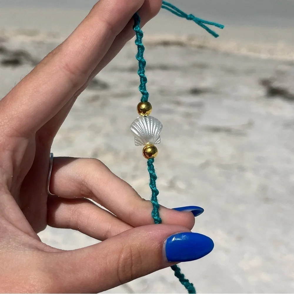Handmade woven teal pearl shell gold bead bracelet